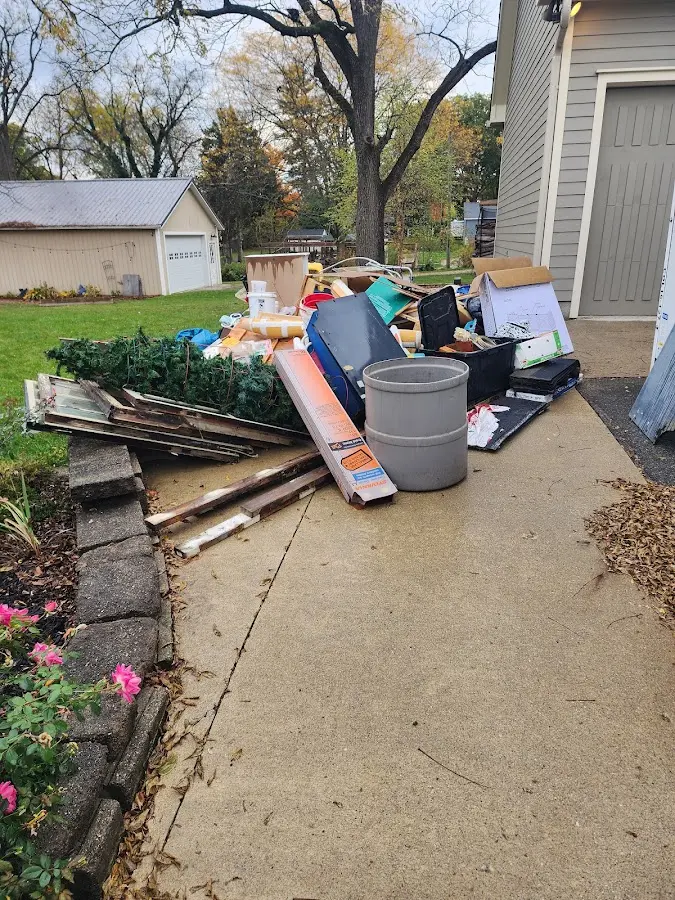 Dumpster being loaded with debris for Residential Dumpster Rental in Woodcrest